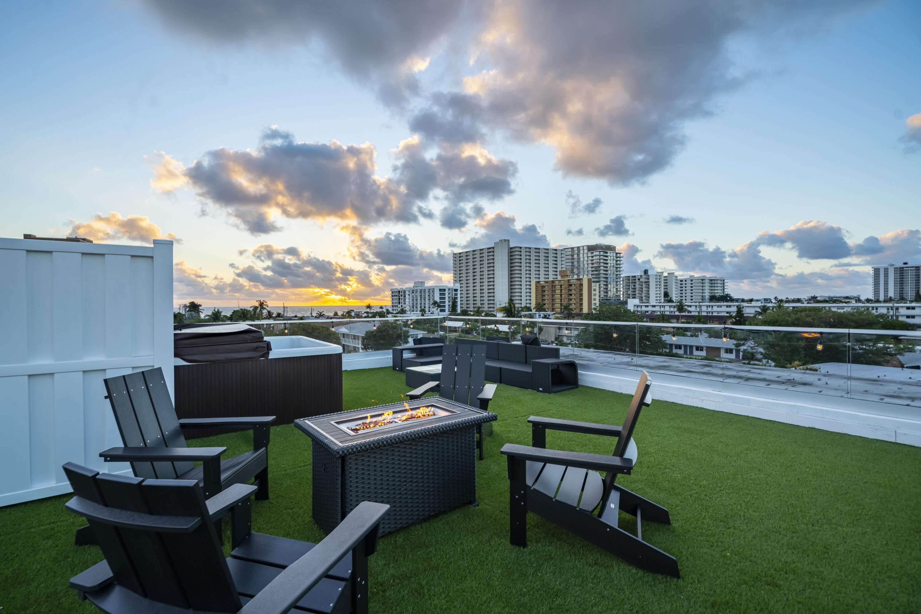 1000 North Riverside Drive Pompano Beach, FL 33062 - Photo 9 of 39 a view of a chairs and table in the back yard of the house