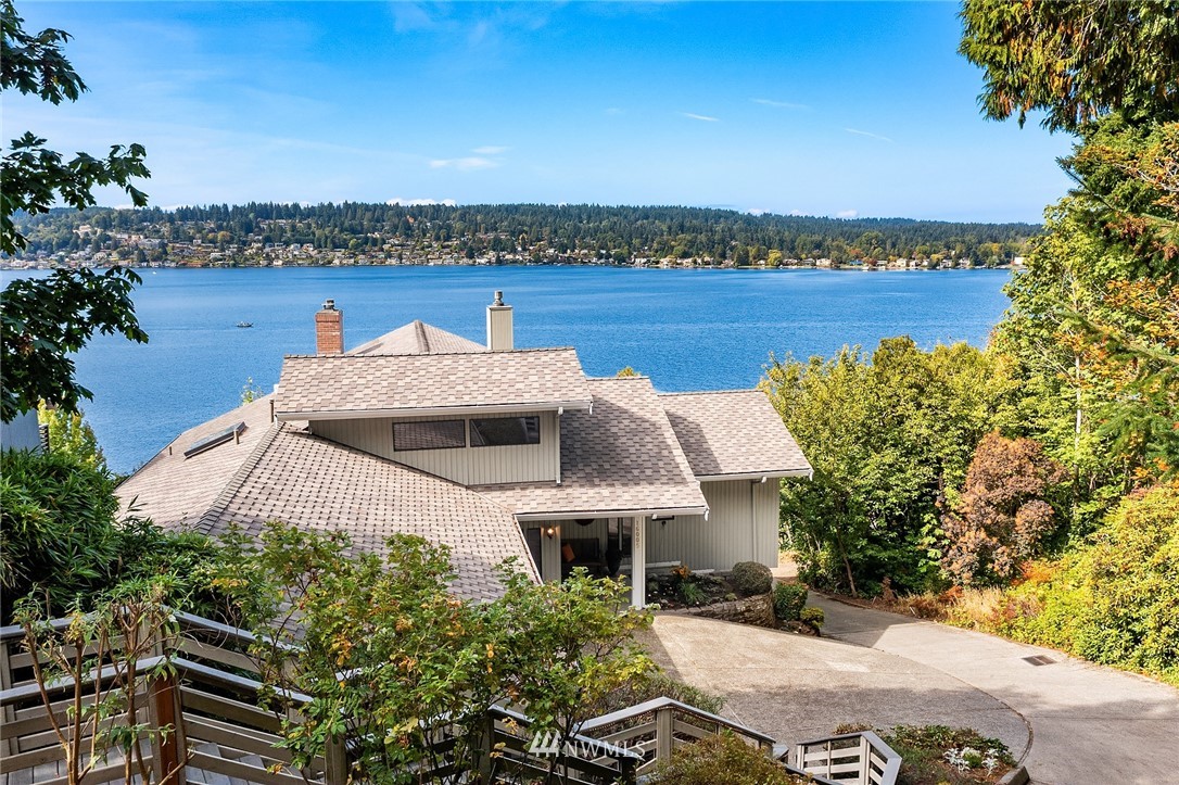 16005 Inglewood Road Northeast Kenmore, WA 98028 - Photo 1 of 39 a front view of a house with a garden