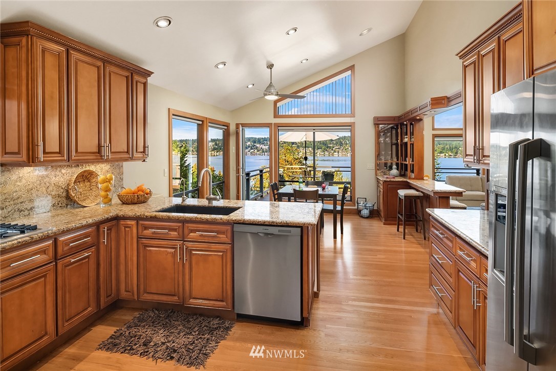 16005 Inglewood Road Northeast Kenmore, WA 98028 - Photo 11 of 39 a living room with furniture and a fireplace
