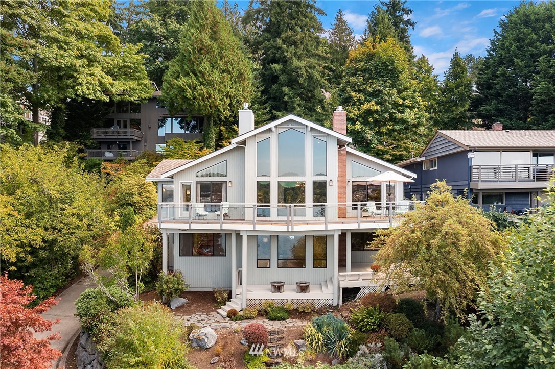 16005 Inglewood Road Northeast Kenmore, WA 98028 - Photo 15 of 39 a front view of a house with a garden