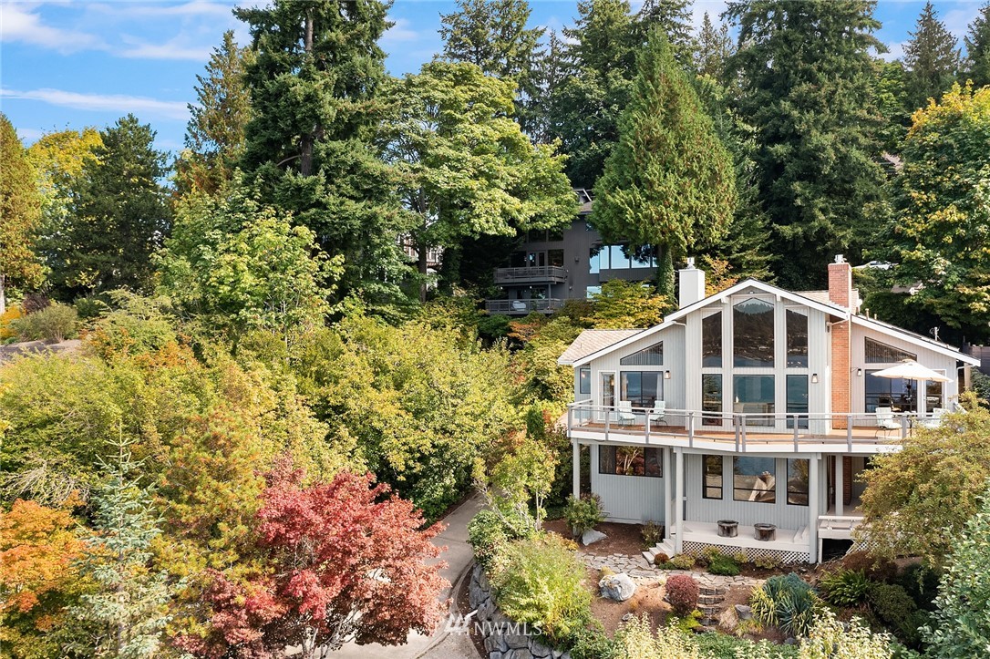 16005 Inglewood Road Northeast Kenmore, WA 98028 - Photo 16 of 39 a kitchen with stainless steel appliances granite countertop sink stove and wooden cabinets
