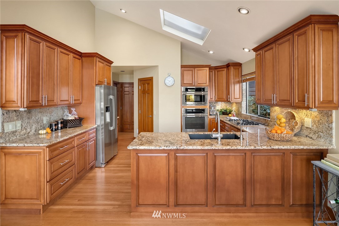 16005 Inglewood Road Northeast Kenmore, WA 98028 - Photo 17 of 39 a living room with couch and a table