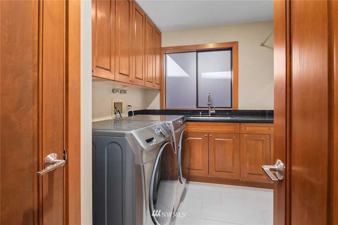 16005 Inglewood Road Northeast Kenmore, WA 98028 - Photo 19 of 39 a utility room with closet and washer