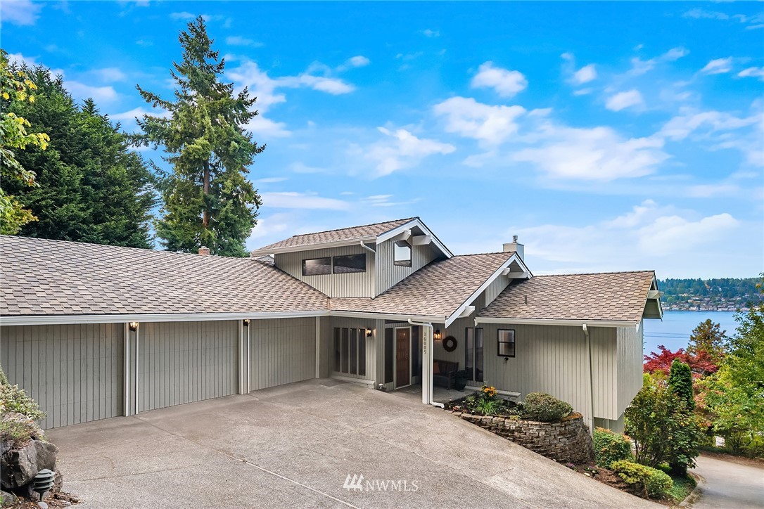 16005 Inglewood Road Northeast Kenmore, WA 98028 - Photo 2 of 39 a backyard of a house with plants and tree