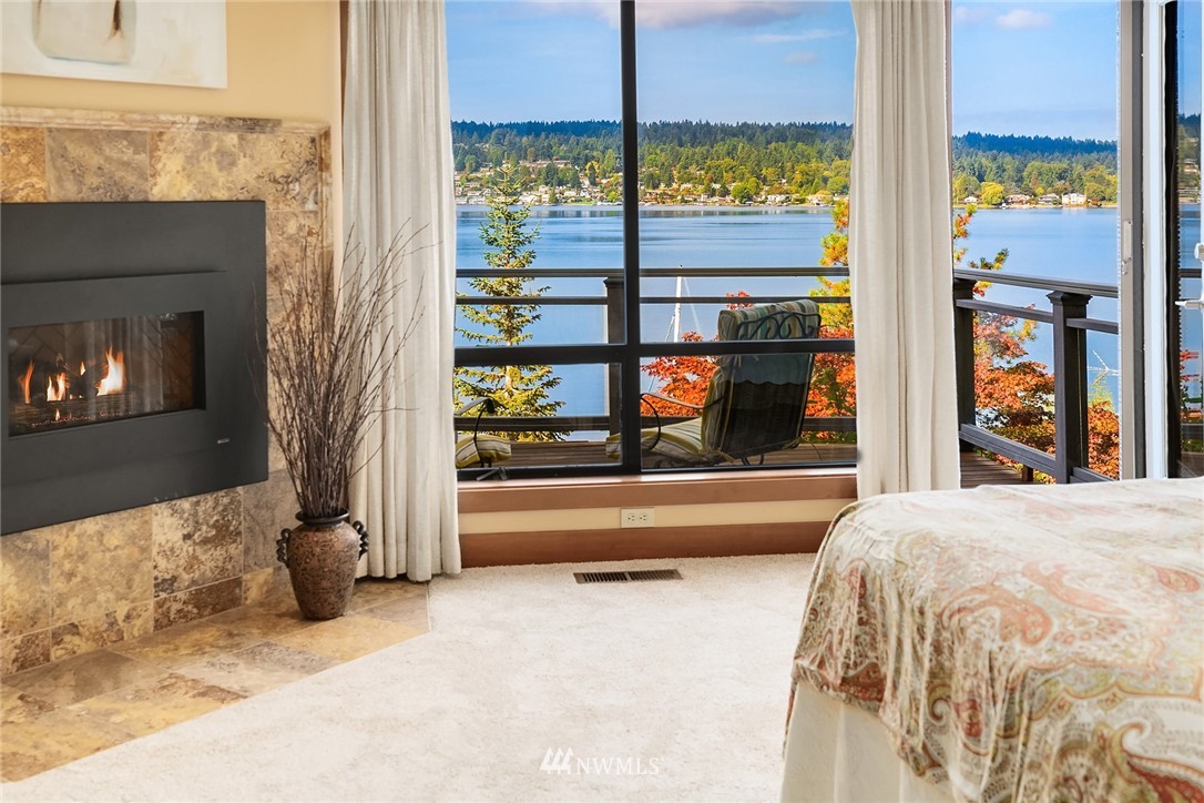 16005 Inglewood Road Northeast Kenmore, WA 98028 - Photo 22 of 39 a bedroom with a bed and large window