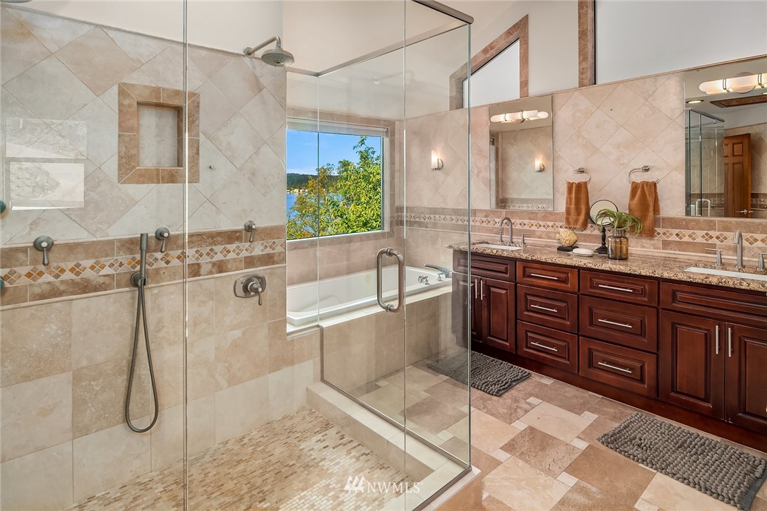 16005 Inglewood Road Northeast Kenmore, WA 98028 - Photo 26 of 39 a spacious bathroom with a granite countertop sink mirror and bathtub