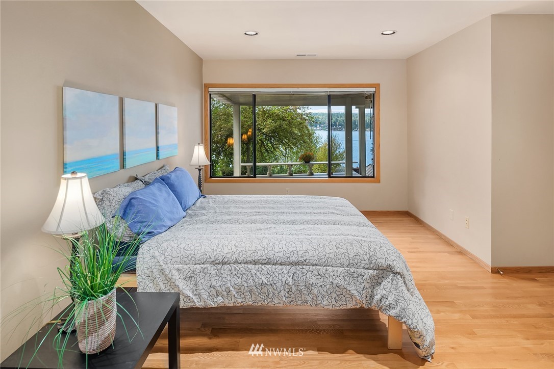 16005 Inglewood Road Northeast Kenmore, WA 98028 - Photo 28 of 39 a bed sitting in a bedroom next to a window