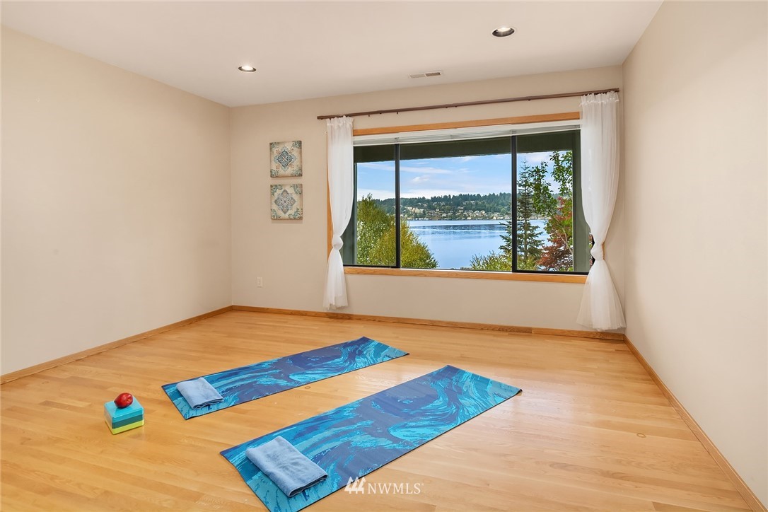 16005 Inglewood Road Northeast Kenmore, WA 98028 - Photo 30 of 39 a bedroom with a bed and a window