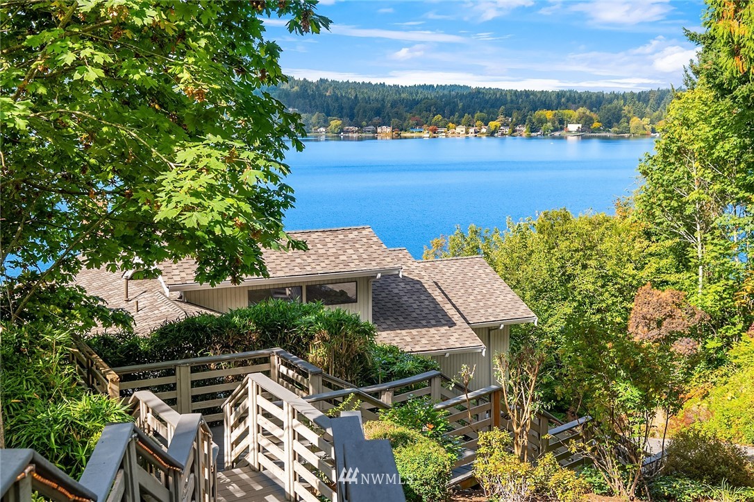 16005 Inglewood Road Northeast Kenmore, WA 98028 - Photo 3 of 39 an aerial view of a house with a lake view