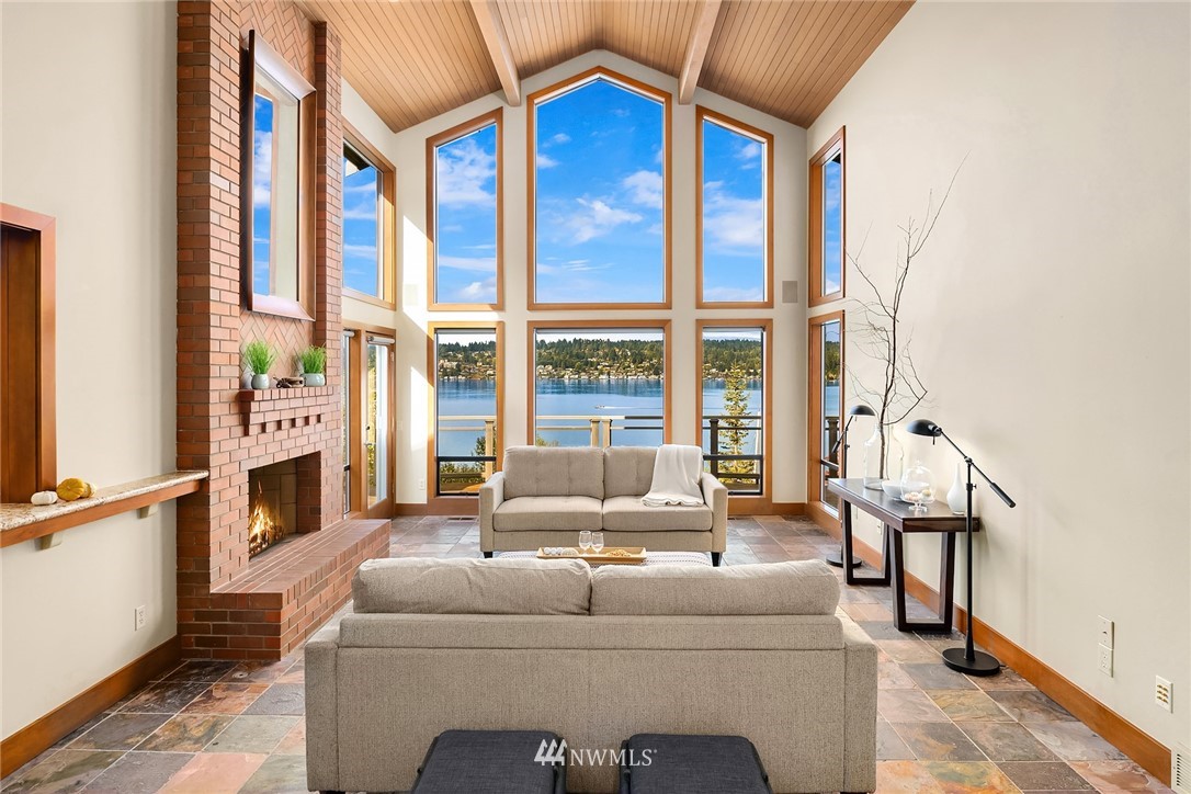 16005 Inglewood Road Northeast Kenmore, WA 98028 - Photo 6 of 39 a view of a balcony with furniture and floor to ceiling window