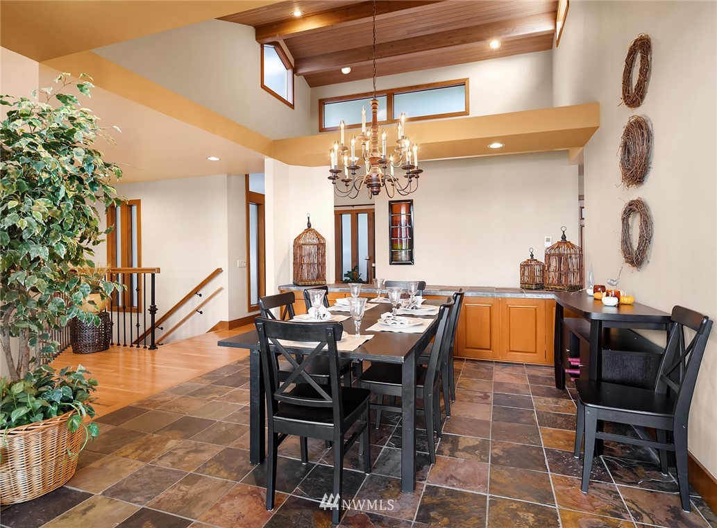 16005 Inglewood Road Northeast Kenmore, WA 98028 - Photo 8 of 39 a view of a dining room with furniture and chandelier