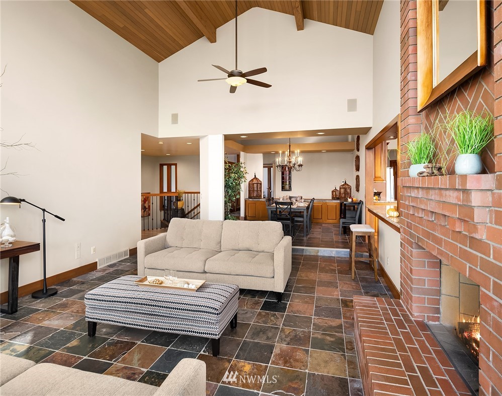 16005 Inglewood Road Northeast Kenmore, WA 98028 - Photo 9 of 39 a view of a dining room with furniture window and wooden floor