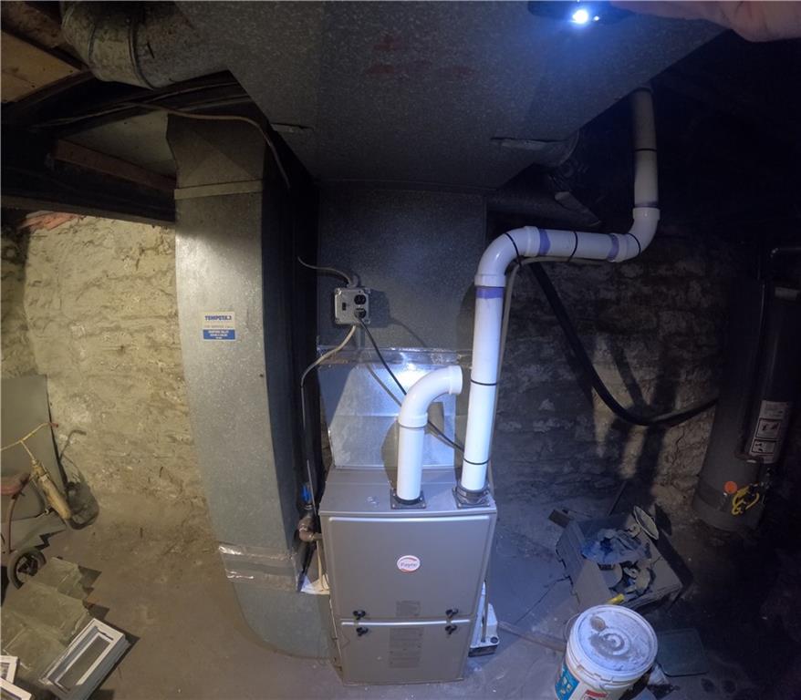 2345 Atmore Street Pittsburgh, PA 15212 - Photo 14 of 17 a room with water heater and wooden cabinets