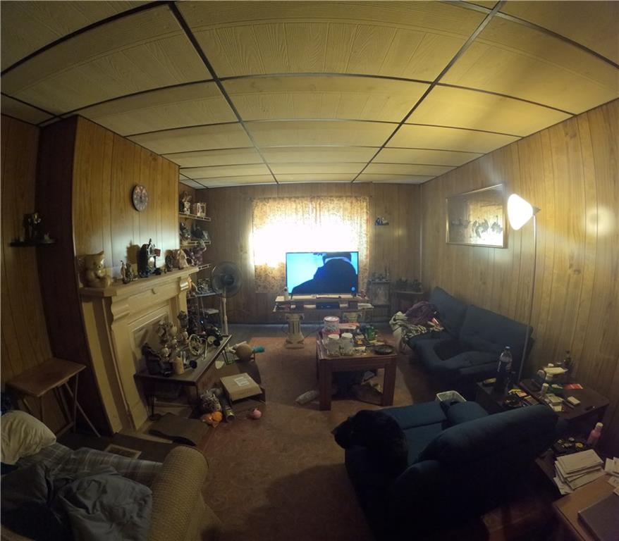2345 Atmore Street Pittsburgh, PA 15212 - Photo 5 of 17 a living room with furniture and a chandelier