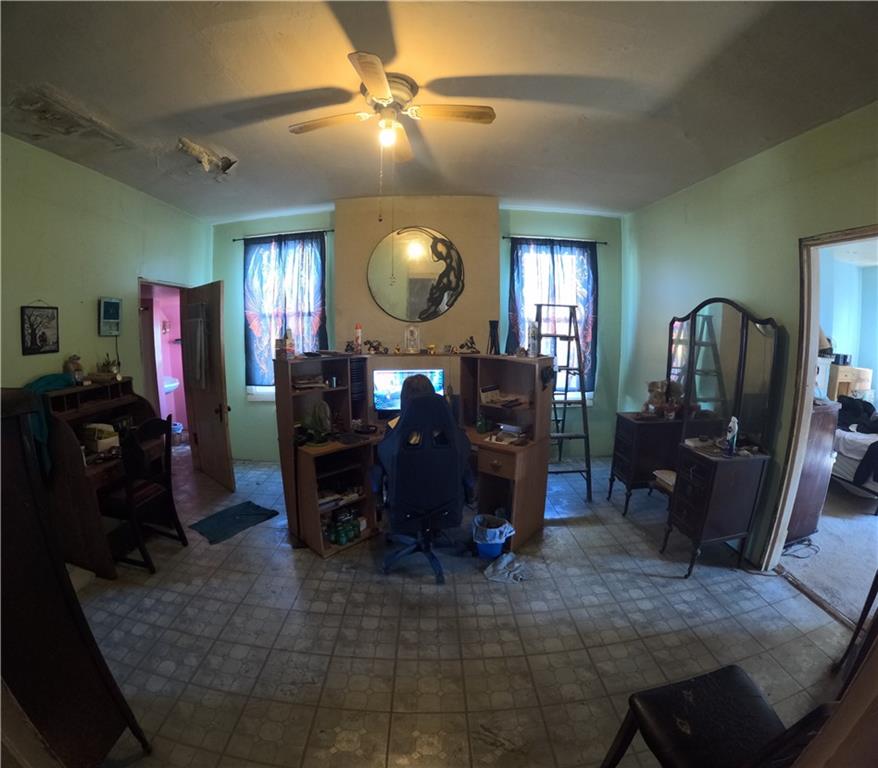 2345 Atmore Street Pittsburgh, PA 15212 - Photo 9 of 17 a living room with furniture a mirror and wooden floor