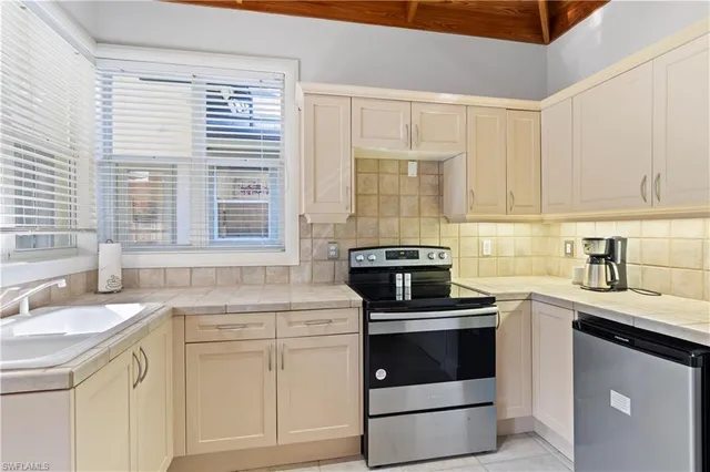a kitchen with a stove and a sink