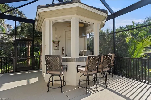 a view of a patio with table and chairs and potted plants