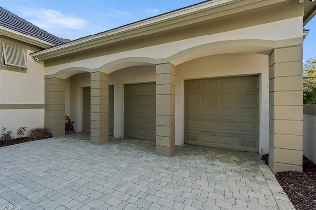 an aerial view of residential houses with outdoor space and swimming pool