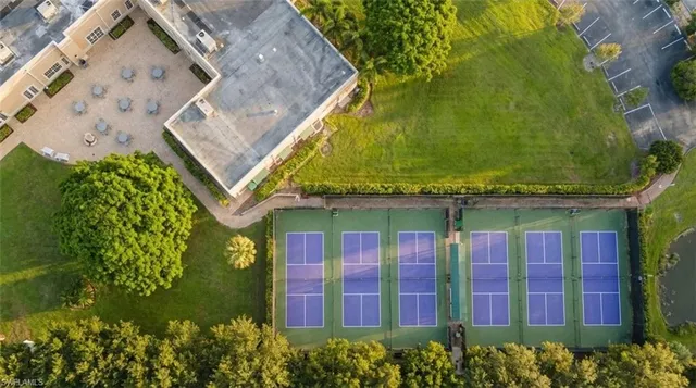 an aerial view of a house with a yard and garden