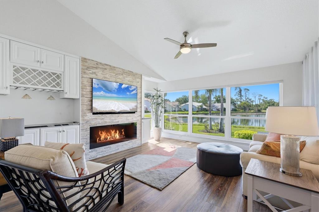 14402 Bridgeview Lane Port Charlotte, FL 33953 - Photo 11 of 93 a living room with furniture fireplace and a large window