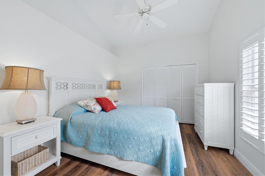 14402 Bridgeview Lane Port Charlotte, FL 33953 - Photo 28 of 93 a bedroom with a bed and wooden floor