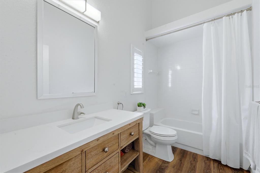 14402 Bridgeview Lane Port Charlotte, FL 33953 - Photo 38 of 93 a bathroom with a granite countertop sink a toilet and shower