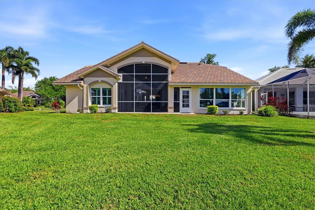 14402 Bridgeview Lane Port Charlotte, FL 33953 - Photo 45 of 93 a front view of a house with a yard