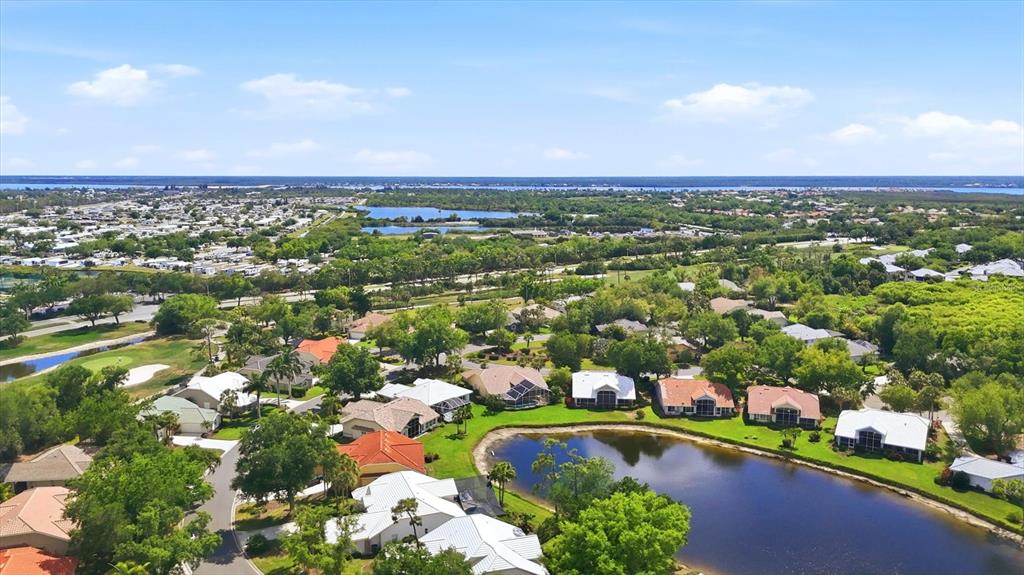 14402 Bridgeview Lane Port Charlotte, FL 33953 - Photo 62 of 93 an aerial view of residential houses with outdoor space and trees