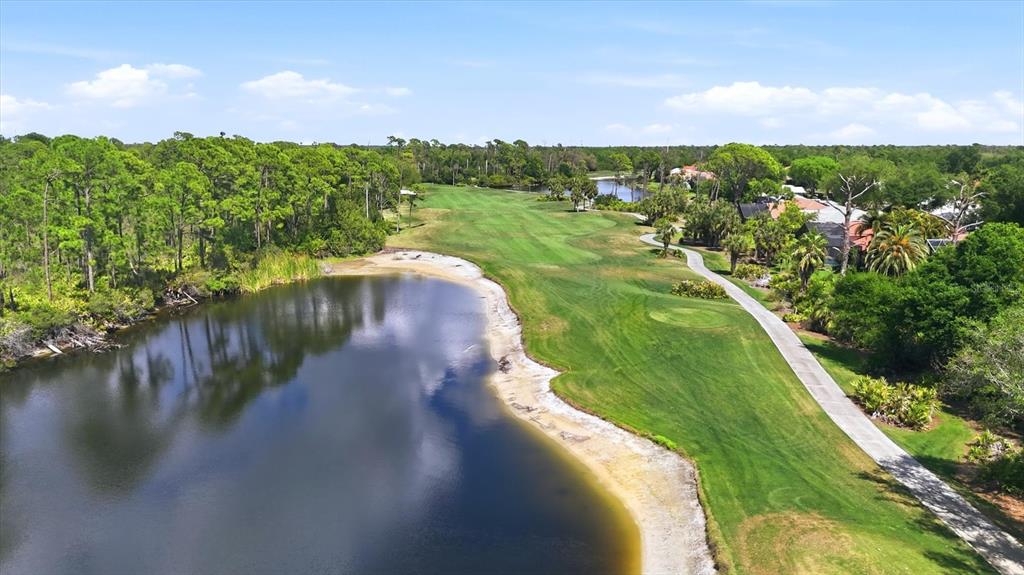 14402 Bridgeview Lane Port Charlotte, FL 33953 - Photo 66 of 93 a view of a lake with a yard