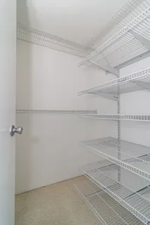 a view of a balcony with wooden floor