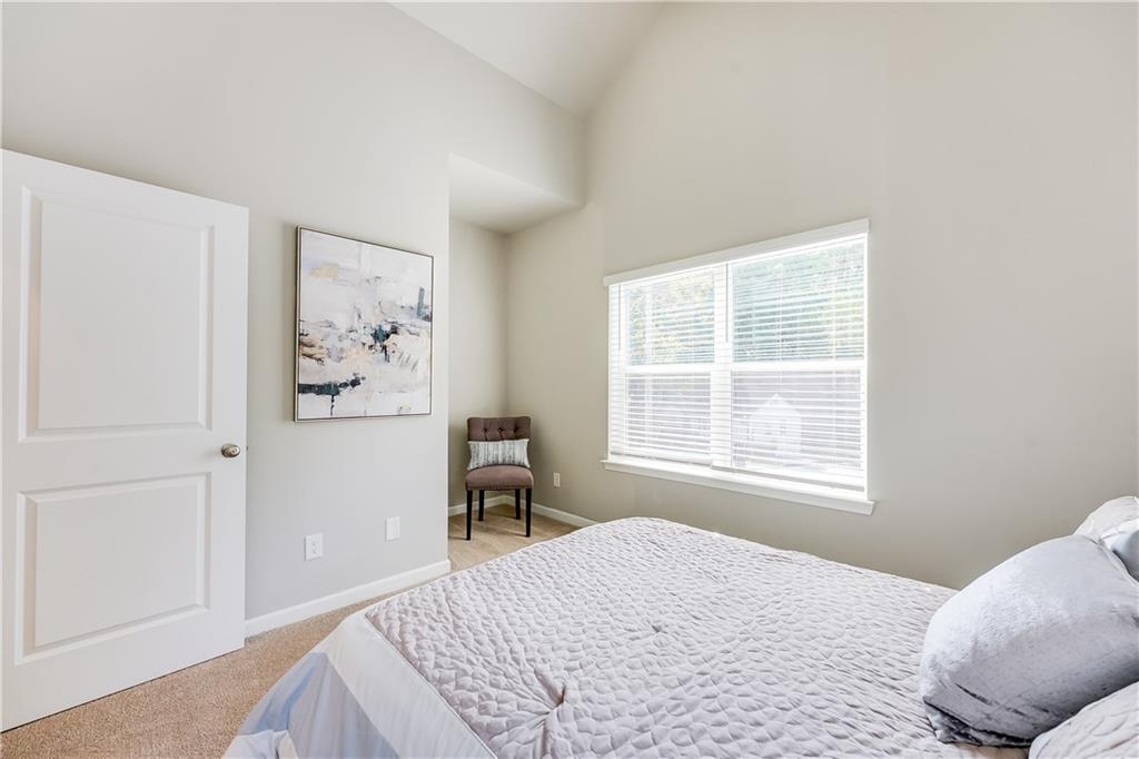 973 Peeples Street Southwest Atlanta, GA 30310 - Photo 12 of 12 a bedroom with a bed and a window