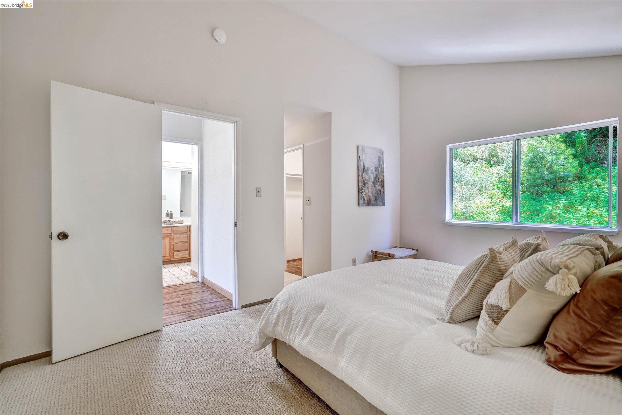 2826 Wright Avenue Pinole, CA 94564 - Photo 42 of 70 Carpeted room with a wide window, white walls, and a vaulted ceiling