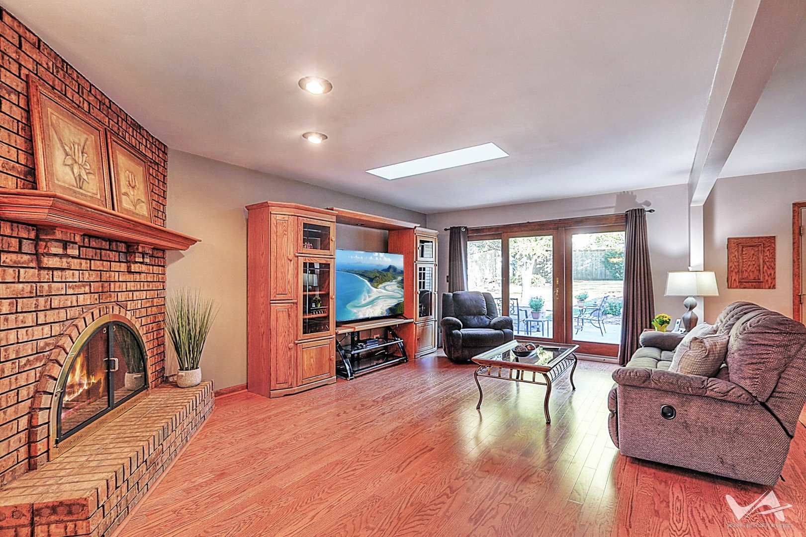 1034 Fall Circle Roselle, IL 60172 - Photo 14 of 30 a living room with fireplace furniture and a flat screen tv