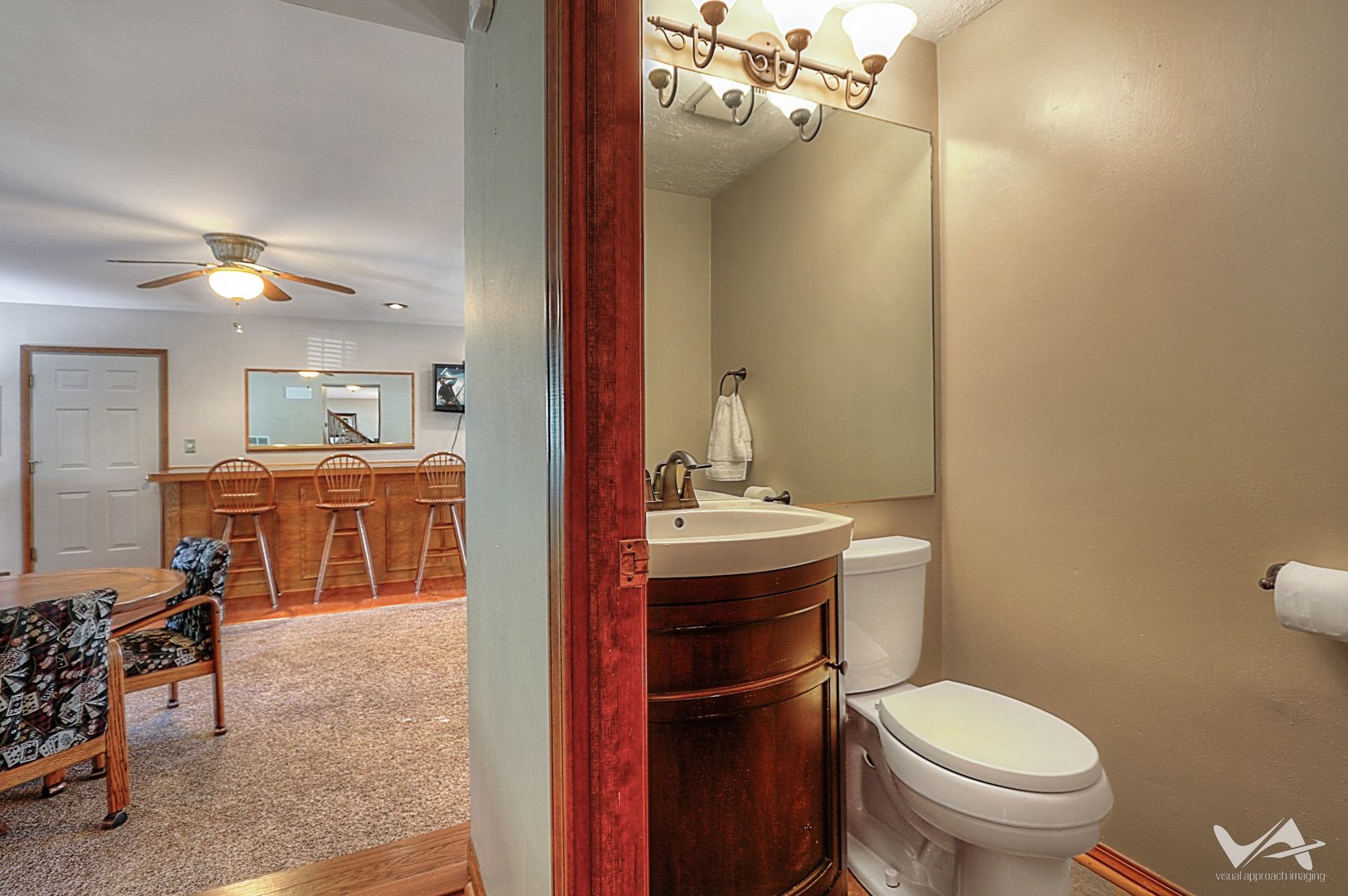 1034 Fall Circle Roselle, IL 60172 - Photo 18 of 30 a bathroom with a toilet a sink and mirror