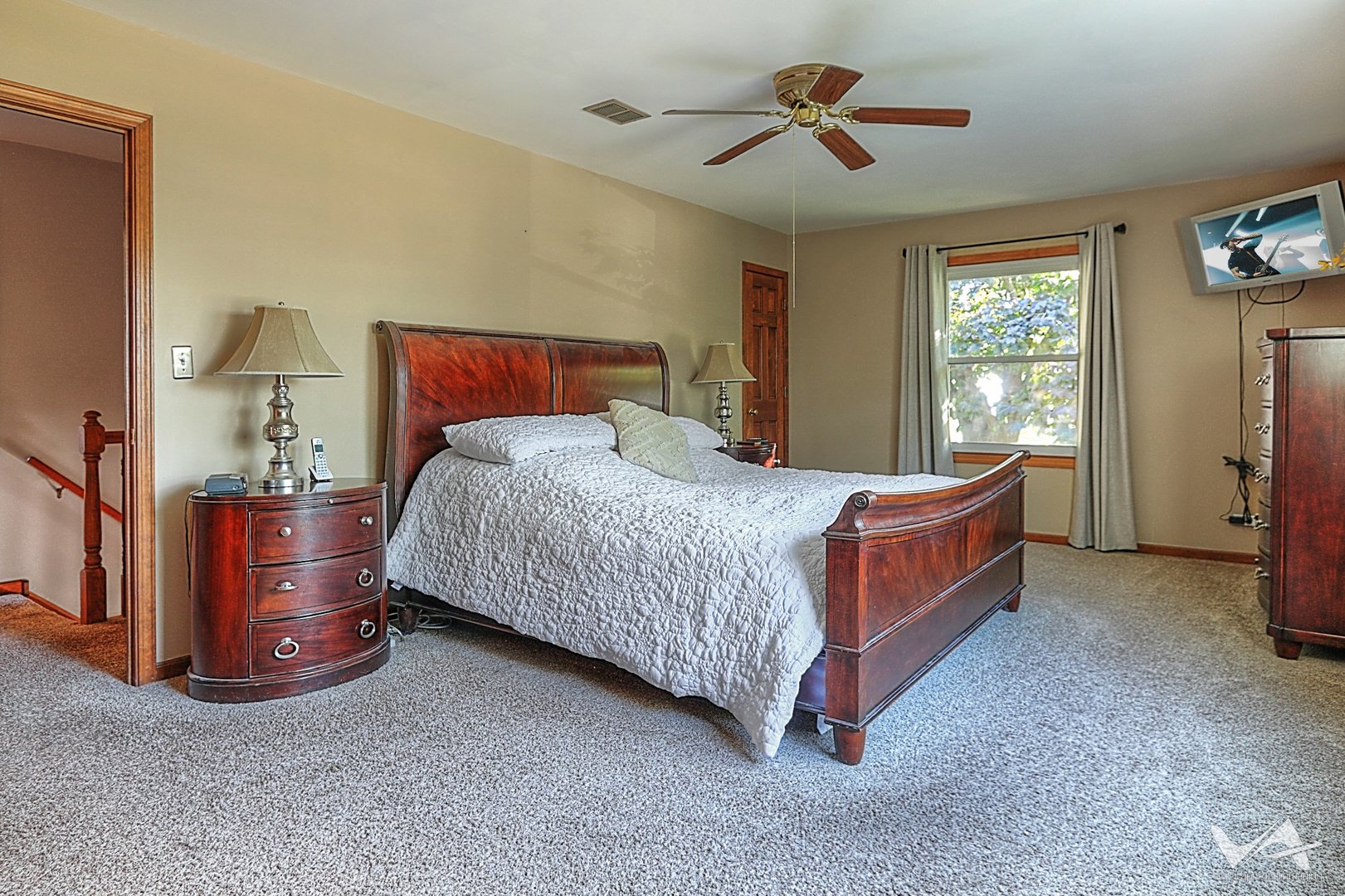 1034 Fall Circle Roselle, IL 60172 - Photo 20 of 30 a bedroom with a bed and a chandelier
