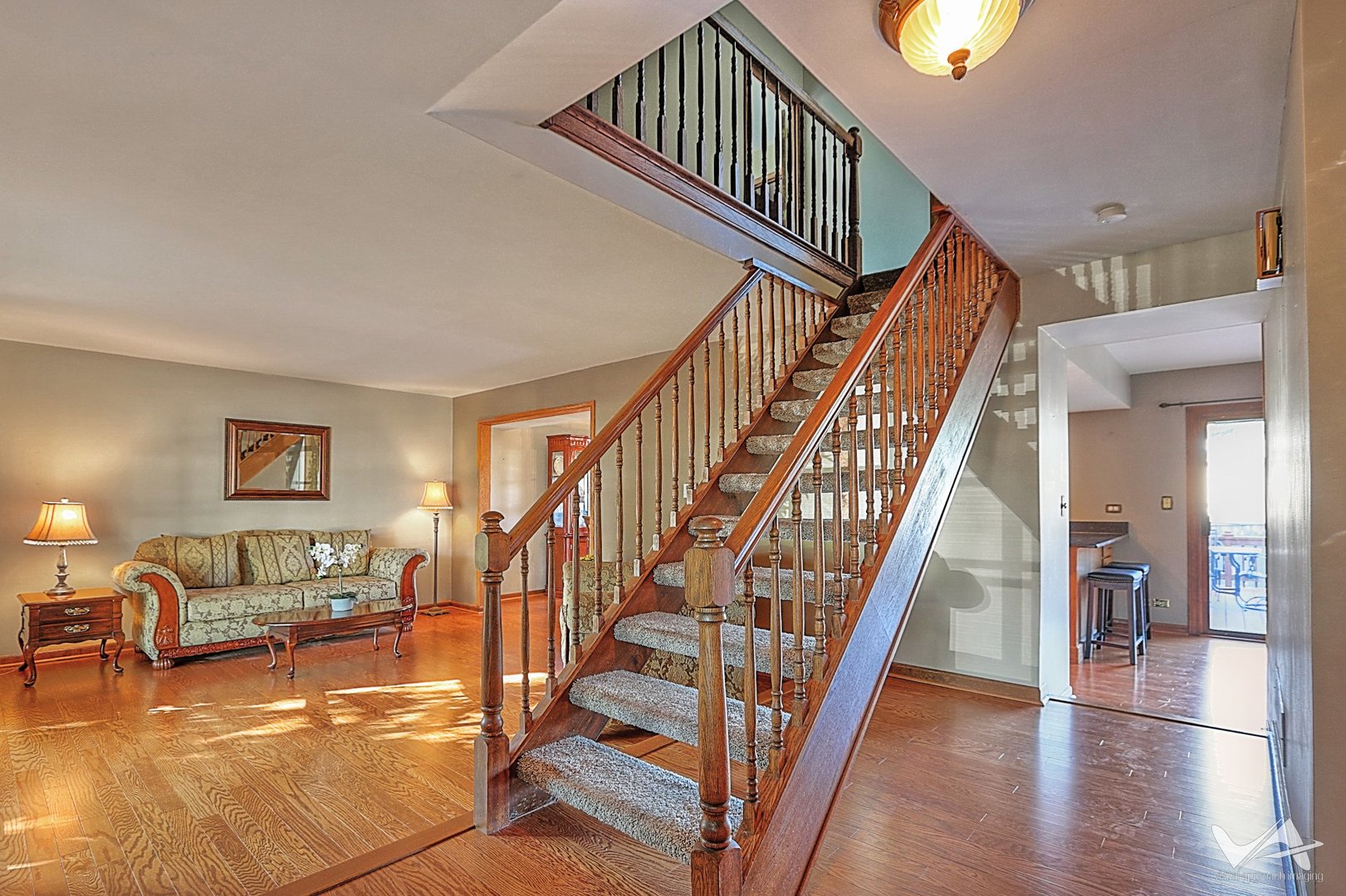 1034 Fall Circle Roselle, IL 60172 - Photo 3 of 30 a view of staircase with wooden floor and a rug