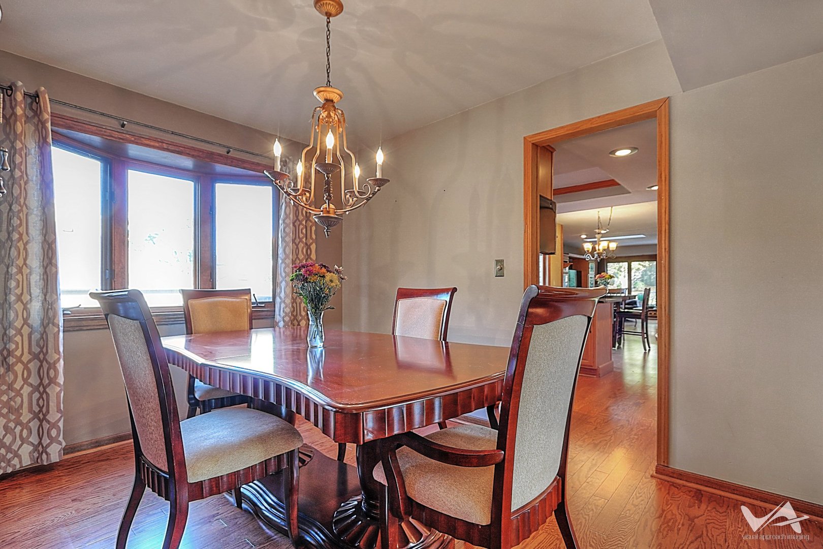 1034 Fall Circle Roselle, IL 60172 - Photo 6 of 30 a view of a dining room with furniture window and wooden floor