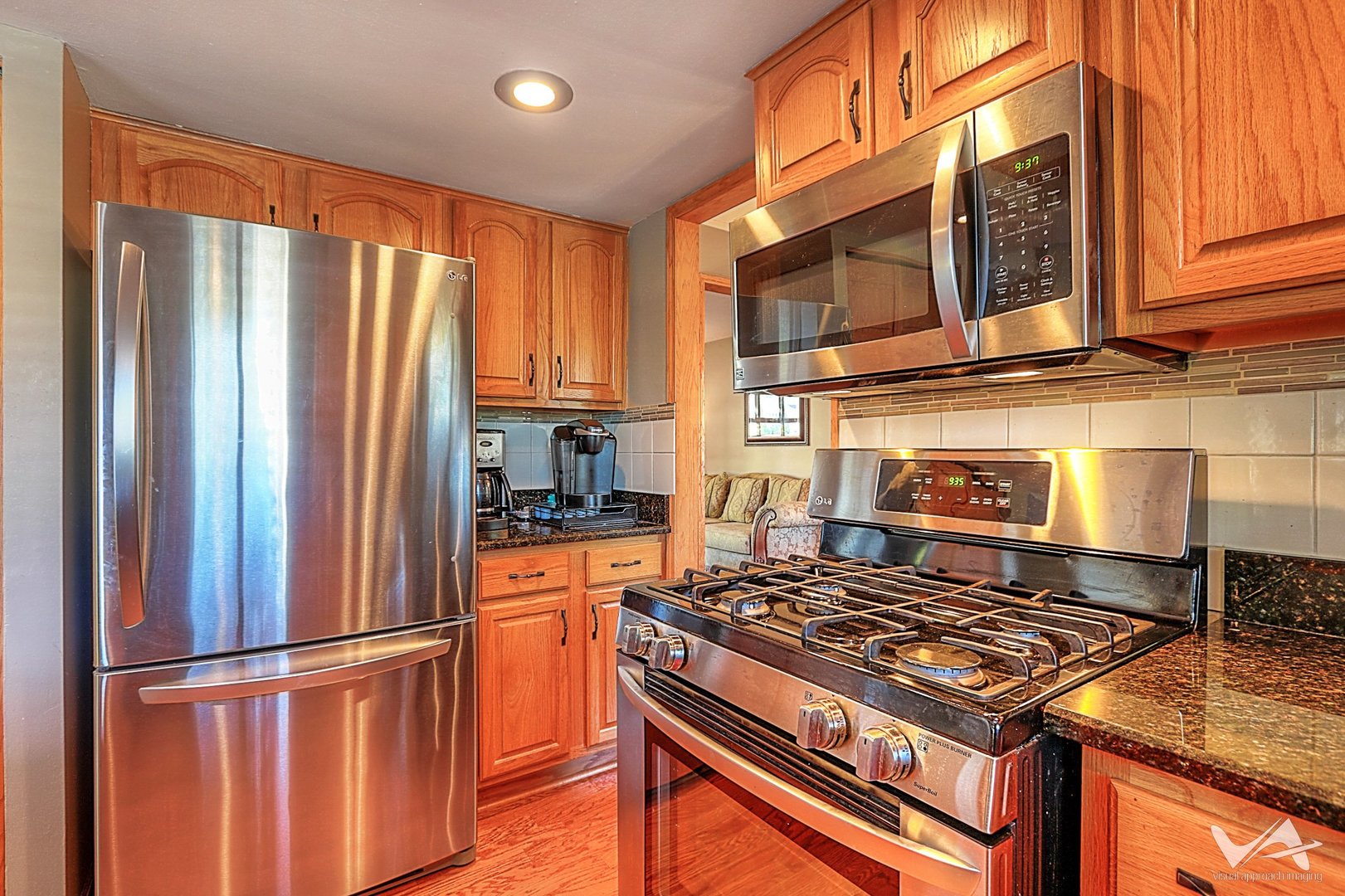 1034 Fall Circle Roselle, IL 60172 - Photo 8 of 30 a kitchen with stainless steel appliances granite countertop a stove top oven a sink and a refrigerator