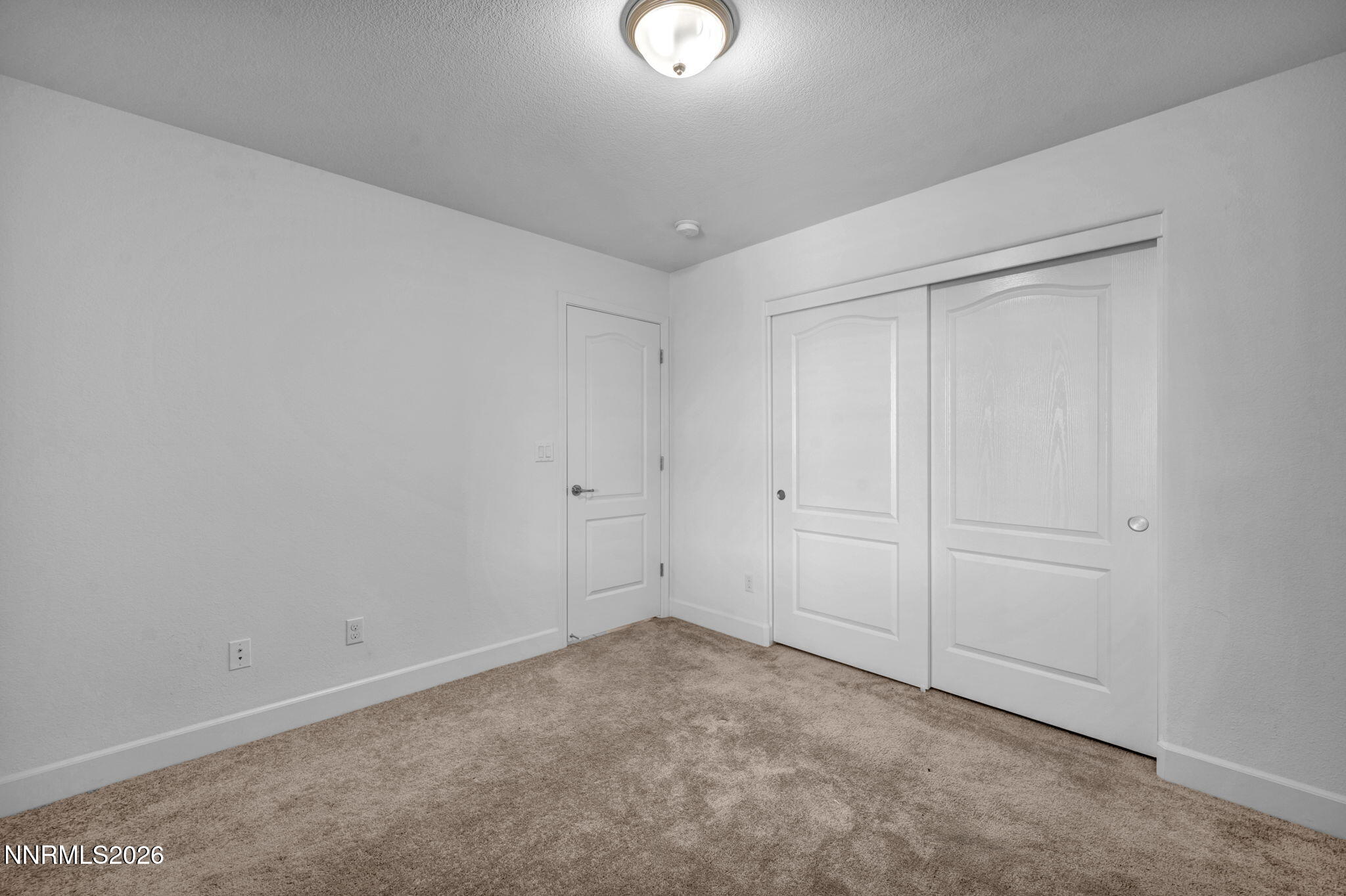 7181 Saddlehorn Road Carson City, NV 89701 - Photo 30 of 62 a view of an empty room