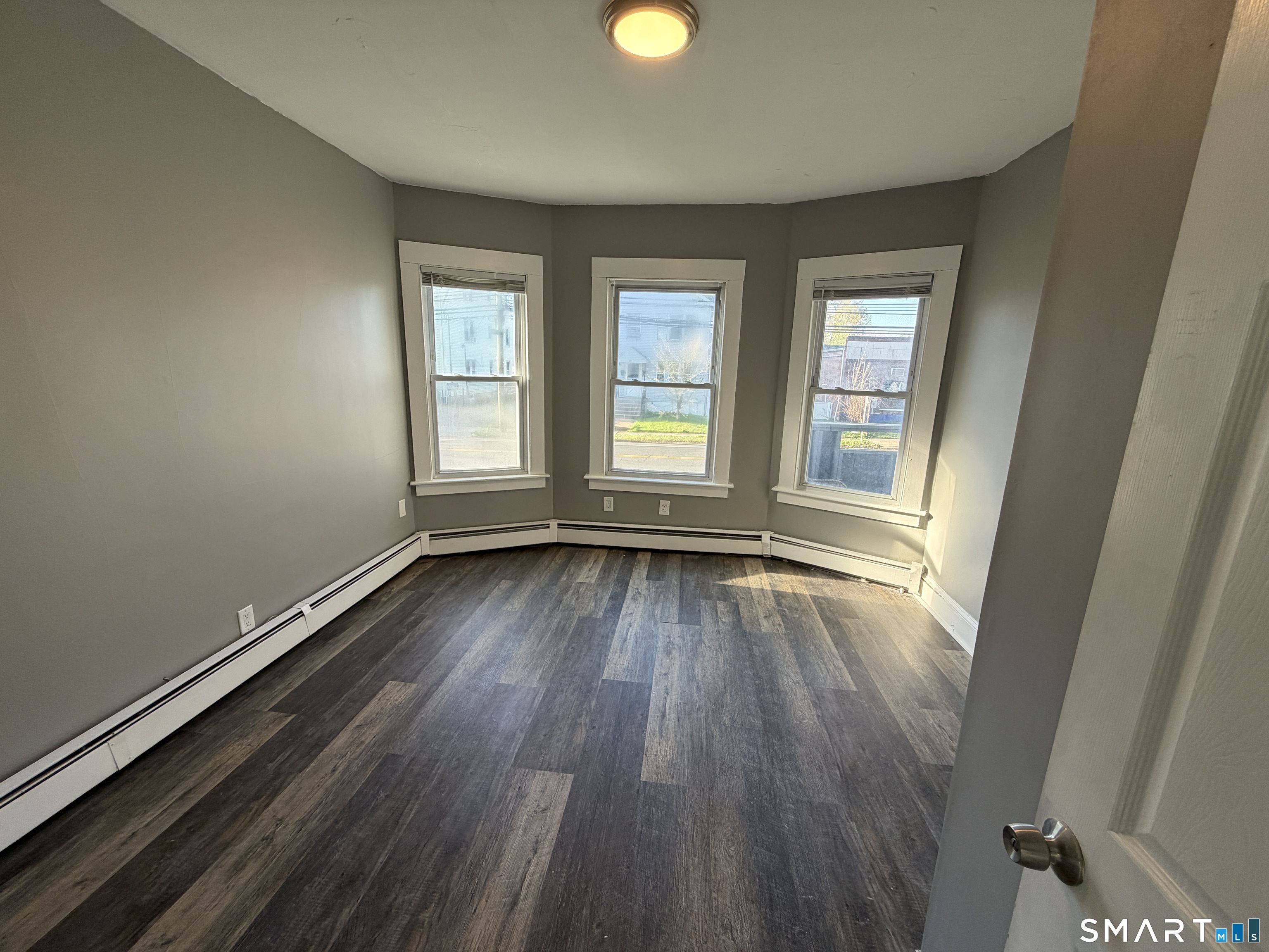 402 Allen Street New Britain, CT 06053 - Photo 12 of 14 wooden floor in an empty room with a window