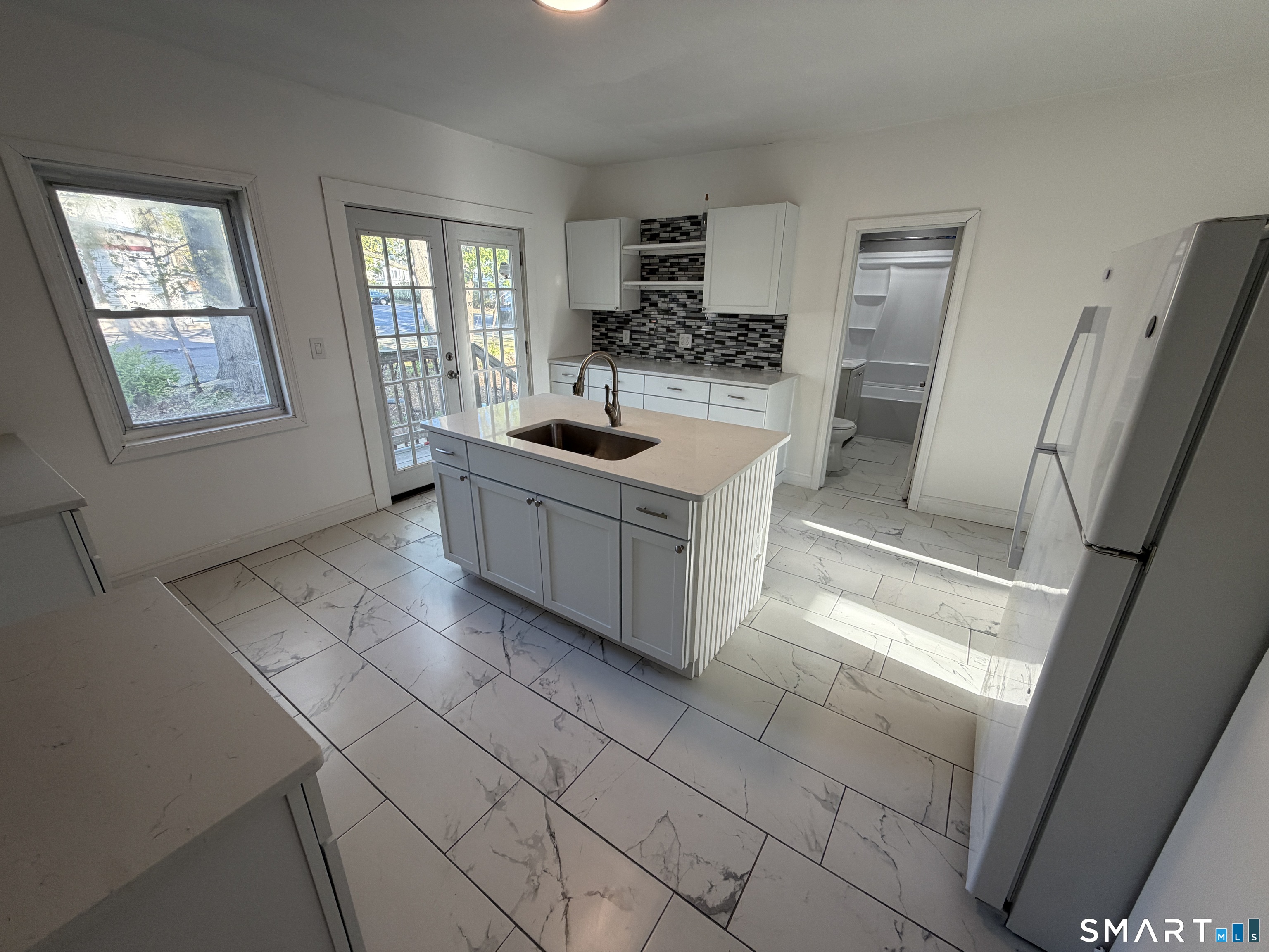 402 Allen Street New Britain, CT 06053 - Photo 2 of 14 a kitchen with stainless steel appliances a sink stove and cabinets