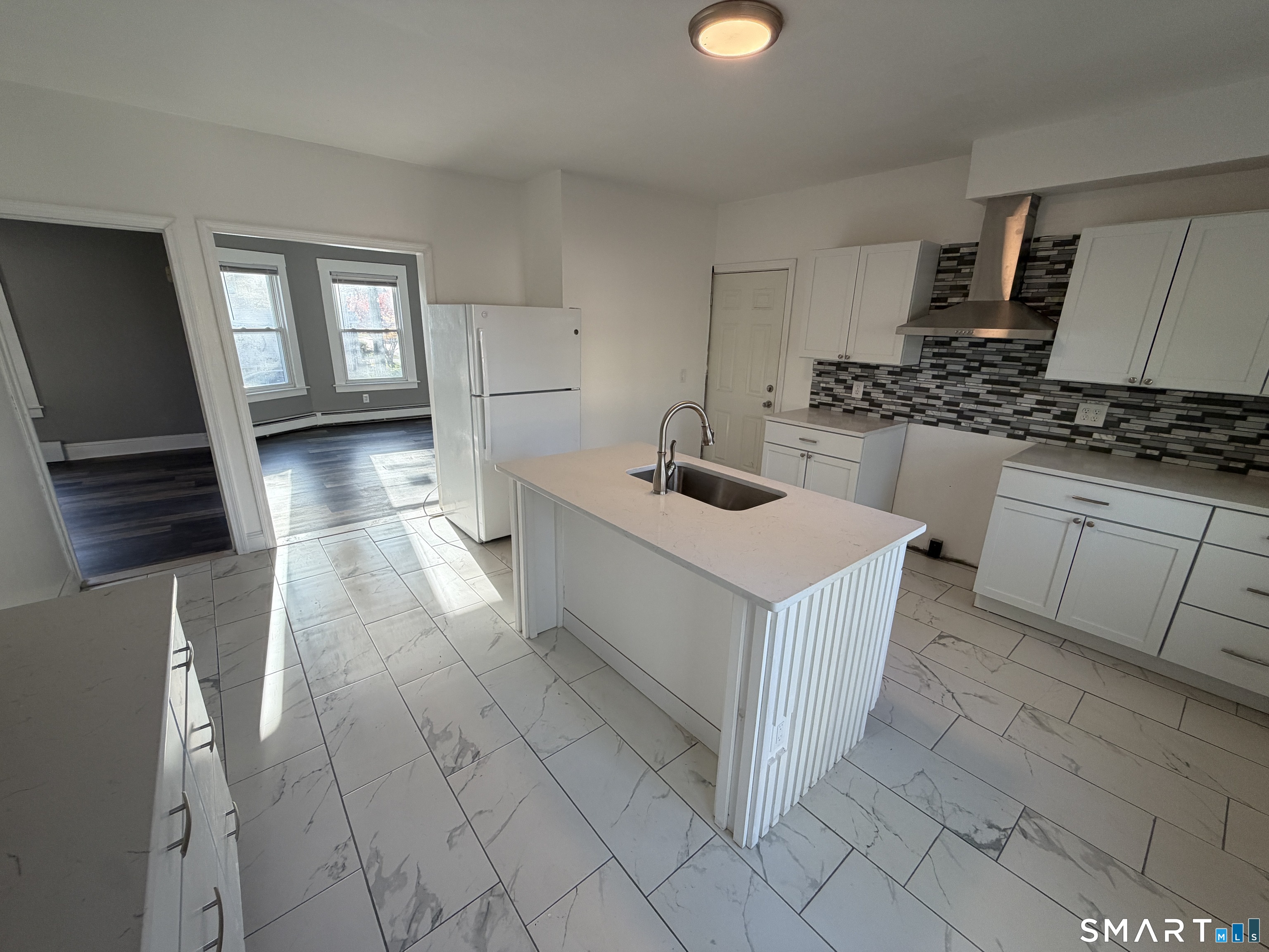 402 Allen Street New Britain, CT 06053 - Photo 4 of 14 a kitchen that has a sink and a stove in it