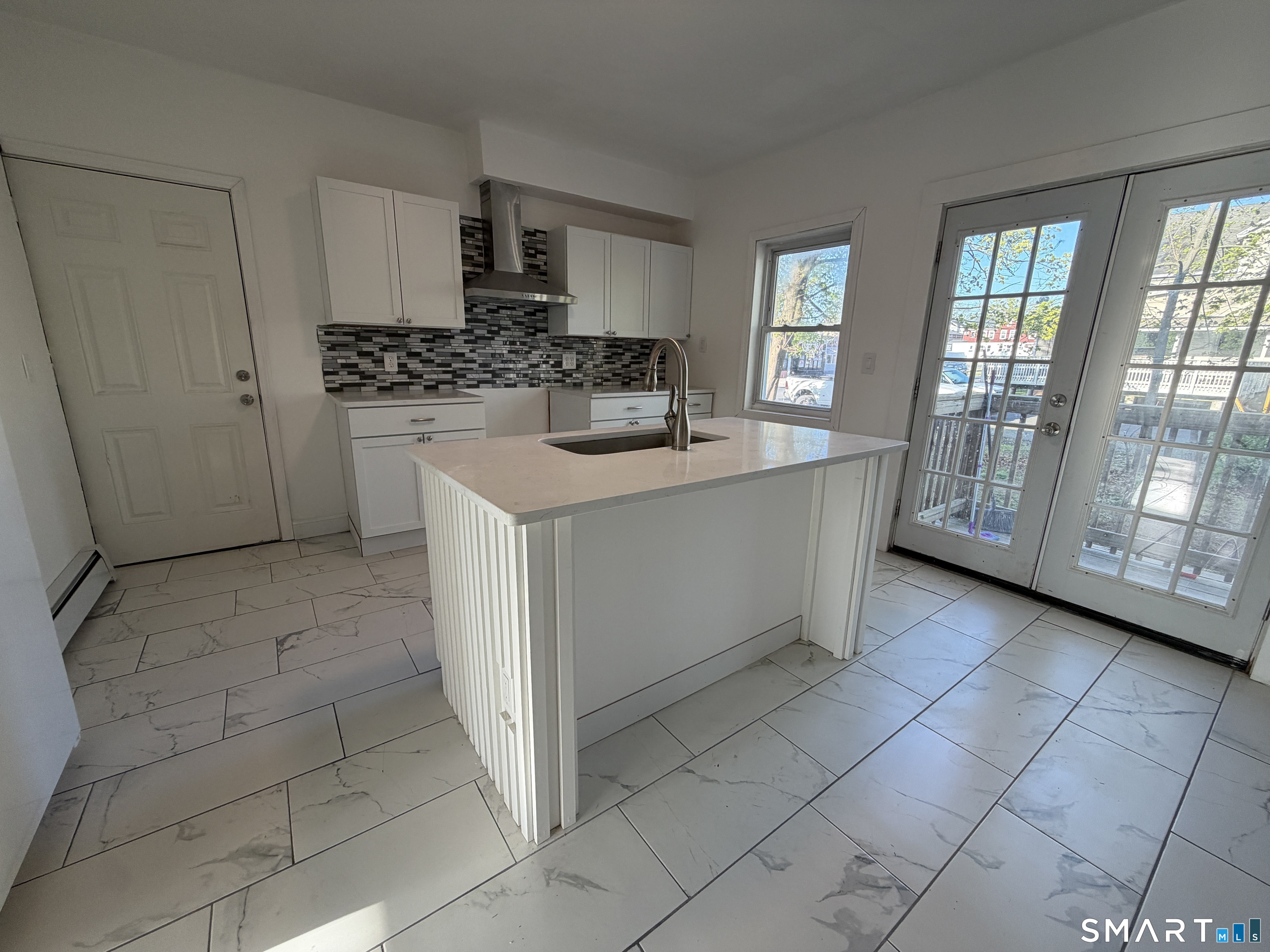 402 Allen Street New Britain, CT 06053 - Photo 5 of 14 a kitchen with stainless steel appliances a sink stove and cabinets
