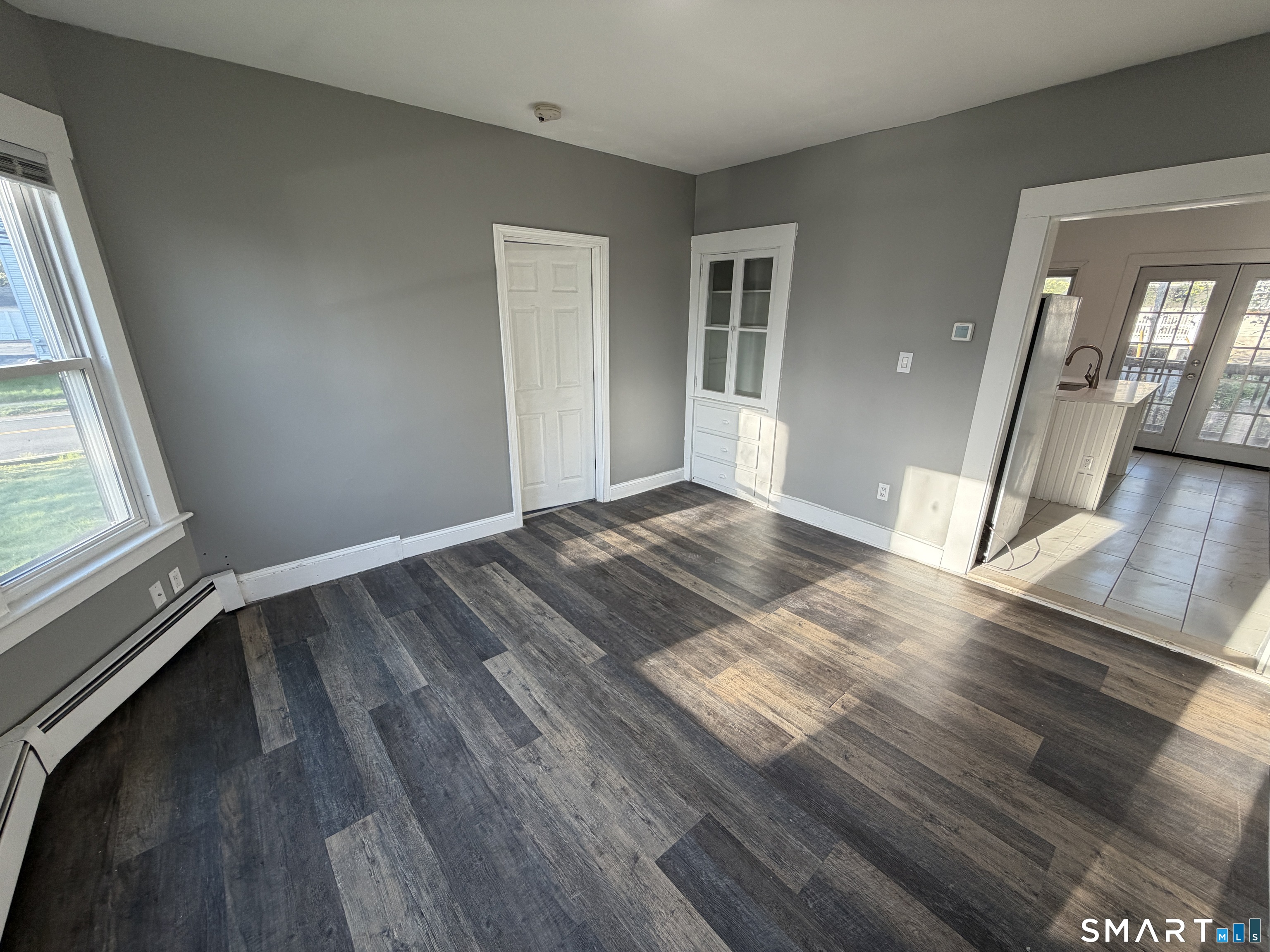 402 Allen Street New Britain, CT 06053 - Photo 7 of 14 wooden floor in an empty room with a window