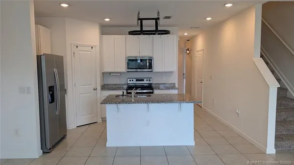 a swimming pool with outdoor seating and yard