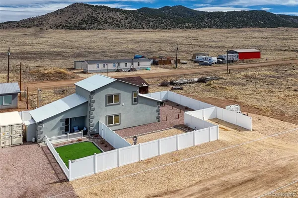 a view of a lake with a houses in the background