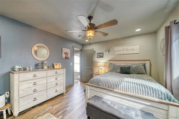 a bedroom with a bed and a dresser