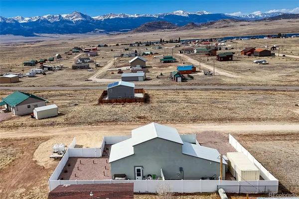 an aerial view of a houses with outdoor space
