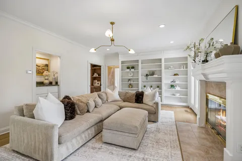 a kitchen with stainless steel appliances kitchen island granite countertop a stove and cabinets