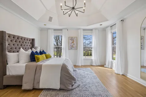 a view of a room with wooden floor and window